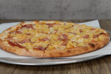 Hawaiian pineapple pizza loaded with vegetable toppings and a crispy crust for a full family meal