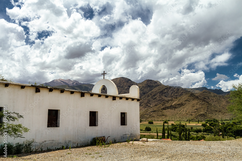 Side view of the San Antonio de Padua chapel with hills in the background, near the town of Cachi, in Salta, Argentina