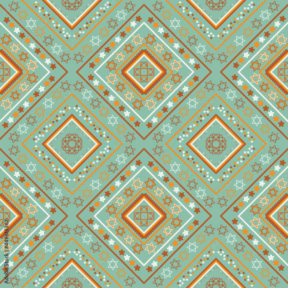 ethnics pattern with geometric seamless flower in green background for fabric