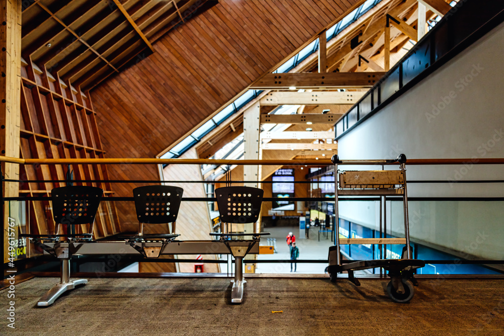 Empty seats and luggage cart at Ushuaia International Airport, Argentina Stock Photo Adobe Stock