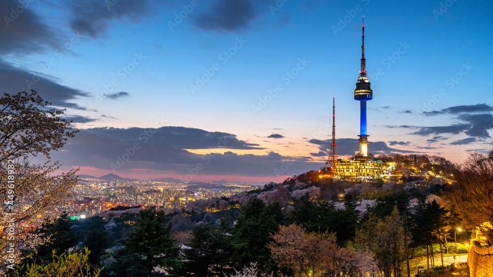 View of sunset in seoul city with seoul tower at namsan public park.