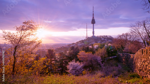 View of sunset in seoul city with seoul tower at namsan public park. photo