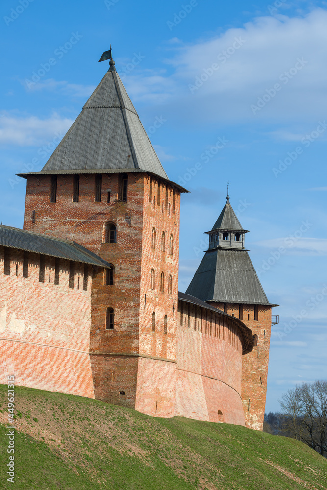 Two towers of the ancient Novgorod Kremlin on a sunny April day. Veliky Novgorod, Russia