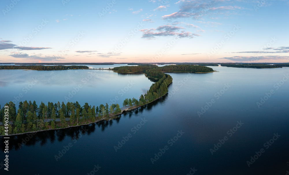 Beautiful ridge road between lakes in Saimaa in summer in Finland.