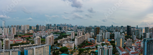 Ultra wide panorama image of Singapore Cityscapes on a cloudy day.