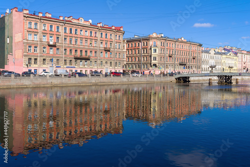 Embankment of the Fontanka river in the Senniy market area on a sunny March day , Saint Petersburg