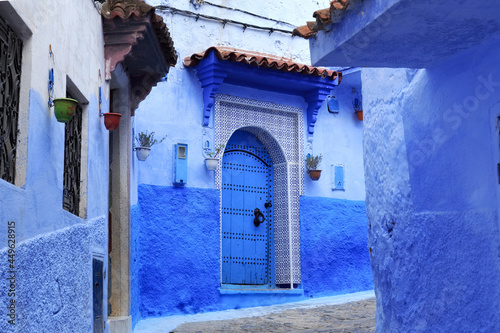 Entrance to the one of the old houses in Medina of Chefchaouen (Chaouen), Morocco. The city is noted for its buildings in shades of blue and that makes Chefchaouen very attractive to visitors. © Renar