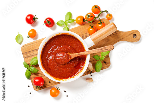 Classic homemade Italian tomato sauce with basil for pasta and pizza. Isolated on white  background. top view photo