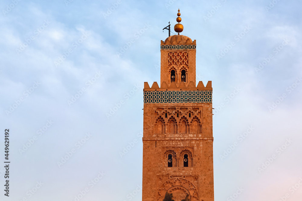 Koutoubia Mosque in the medina quarter of Marrakesh, Morocco. It is largest mosque in town and located near the famous public place of Jemaa el-Fna, and is flanked by large gardens.