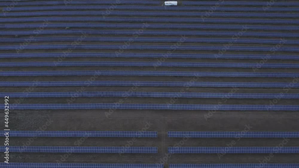 Solar power plant with an aerial view. Huge number of panels. Concept of technology for development of renewable and clean energy sources. Aerial photography of solar energy panels, horizontally