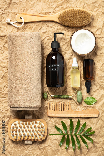 Natural cosmetic SPA products on crumpled paper background, top view. Organic beauty product packaging design