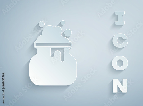 Paper cut Witch cauldron icon isolated on grey background. Happy Halloween party. Paper art style. Vector
