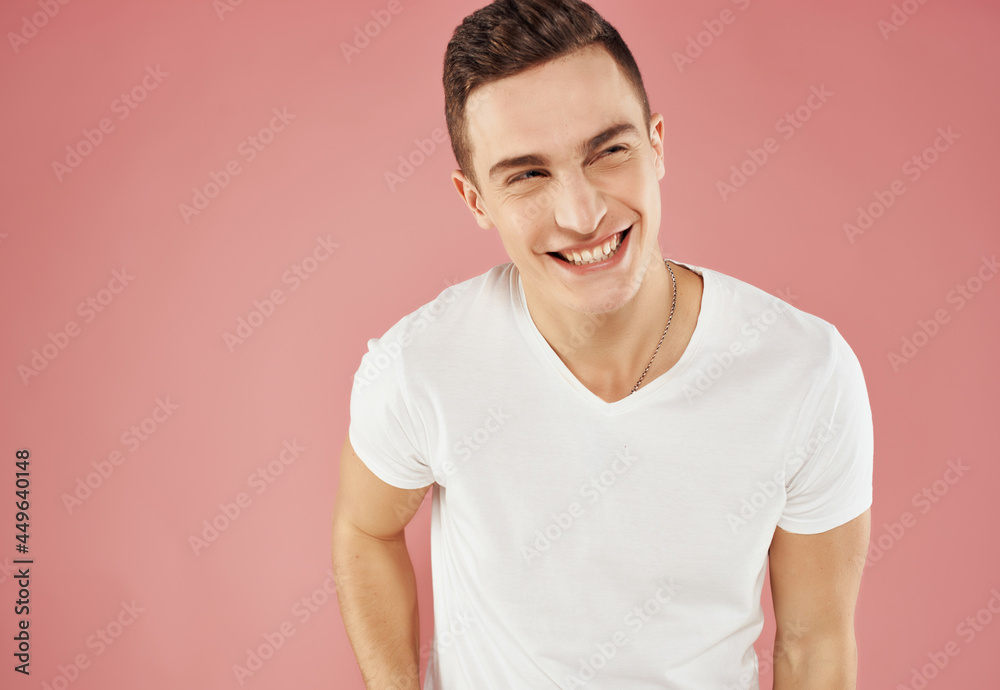 smiling man close-up white t-shirt pink background smiling man close-up white t-shirt pink background