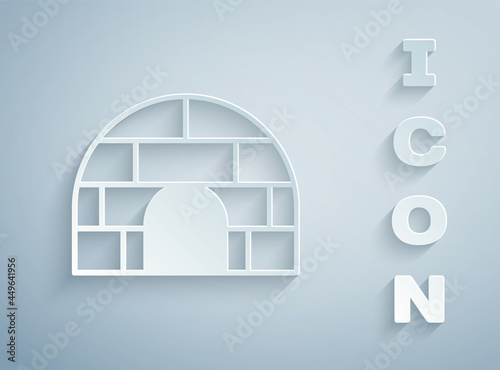 Paper cut Igloo ice house icon isolated on grey background. Snow home, Eskimo dome-shaped hut winter shelter, made of blocks. Paper art style. Vector