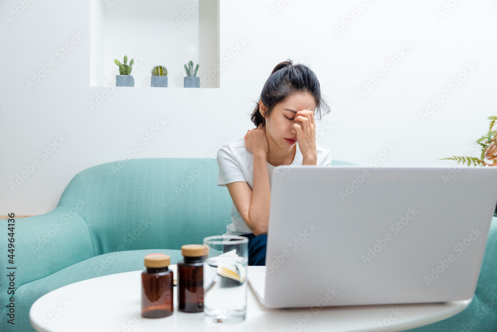 Asian young woman sneezing and coughing at home Asian young woman sneezing and coughing at home
