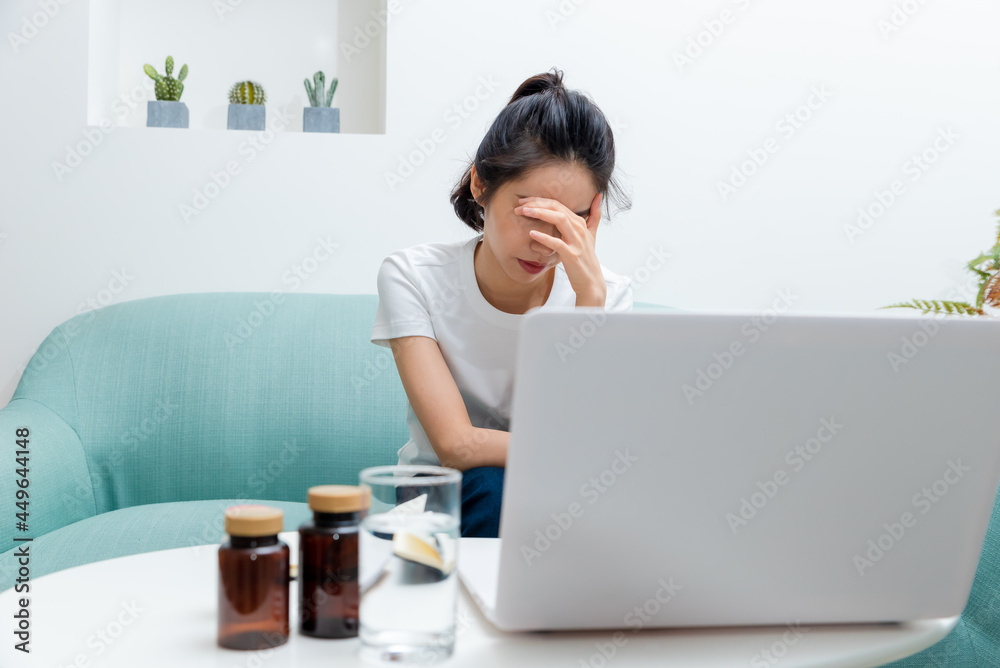 Asian young woman sneezing and coughing at home Asian young woman sneezing and coughing at home