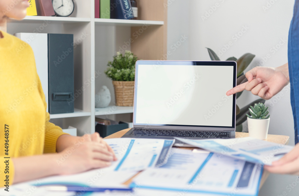 Fototapeta premium Businessman hands using laptop with blank screen. Mock-up of computer monitor. Copyspace ready for design or text.