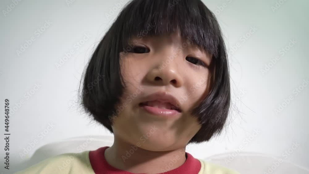 Low angle view the head of little girl read book Low angle view the head of little girl read book