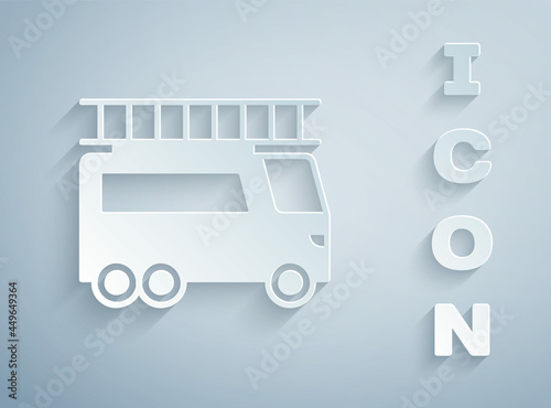 Paper cut Fire truck icon isolated on grey background. Fire engine. Firefighters emergency vehicle. Paper art style. Vector