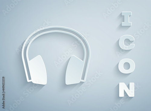 Paper cut Noise canceling headphones icon isolated on grey background. Headphones for ear protection from noise. Paper art style. Vector