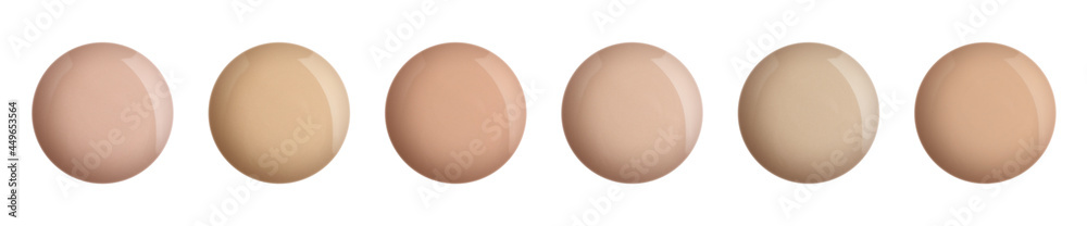Set with different shades of liquid skin foundation on white background, top view. Banner design Set with different shades of liquid skin foundation on white background, top view. Banner design