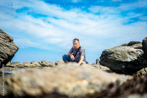 man on the rocky seashore