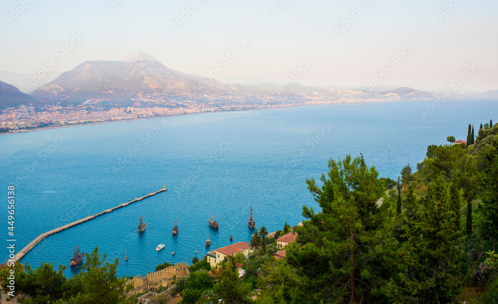 Alanya panorama at sunset overlooking the Mediterranean seaport and mountains