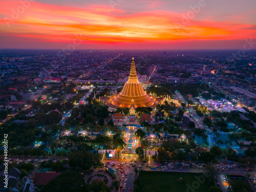 The aerial view of big pagoda in Nakhon Patom, Thailand with sunset background