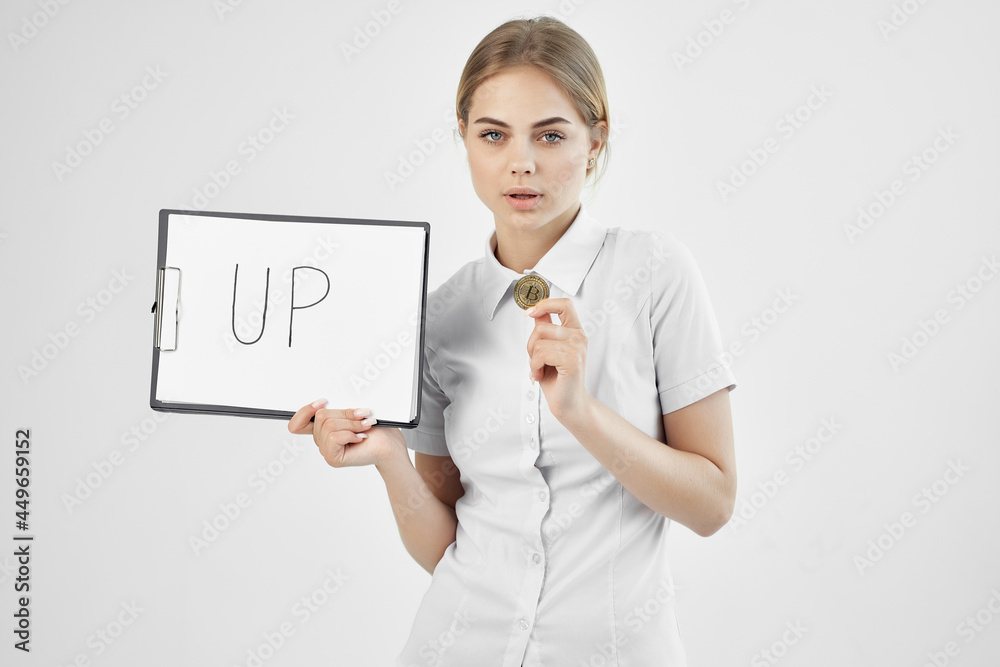 woman in white shirt coin cryptocurrency raising woman in white shirt coin cryptocurrency raising