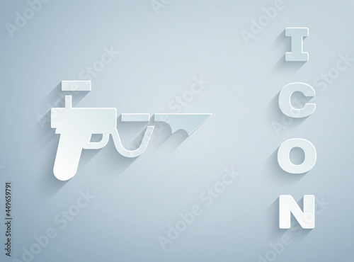 Paper cut Fishing harpoon icon isolated on grey background. Fishery manufacturers for catching fish under water. Diving underwater equipment. Paper art style. Vector