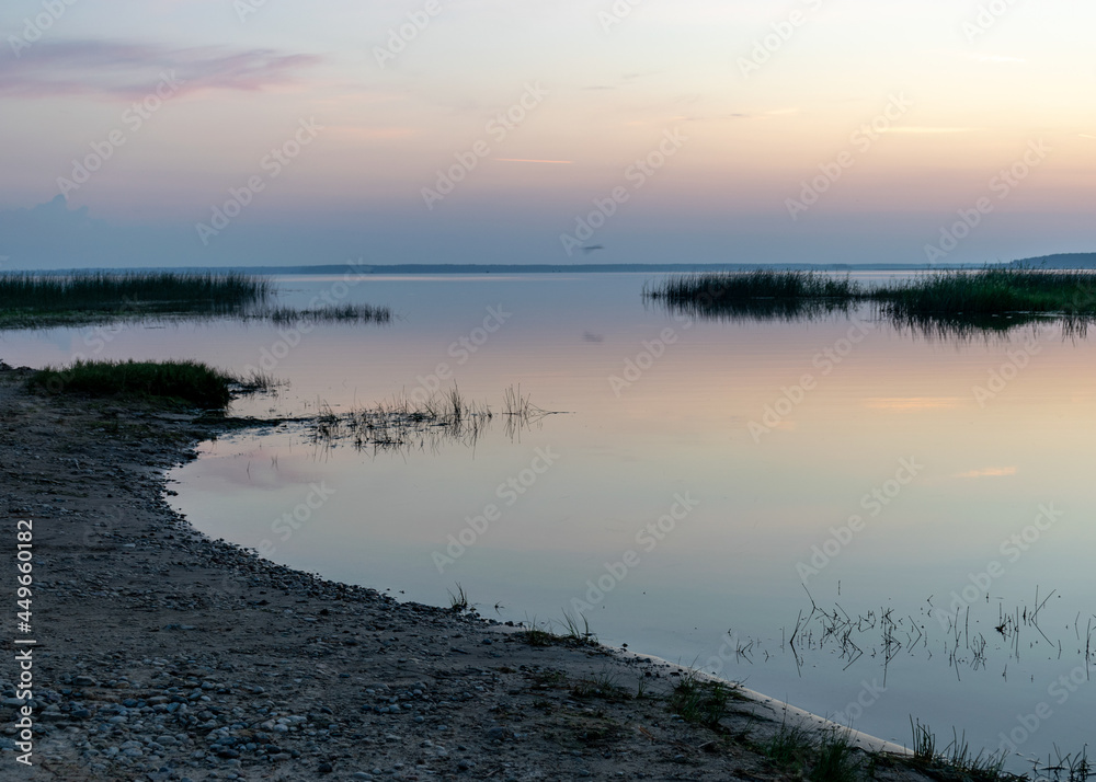 summer landscape on the shore of the lake at dawn, colors in the sky before sunrise, Lake Burtnieki, Latvia