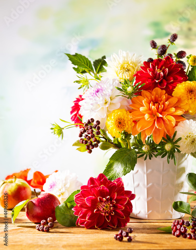 Autumn still life with garden flowers. Beautiful autumnal bouquet in vase, ap...