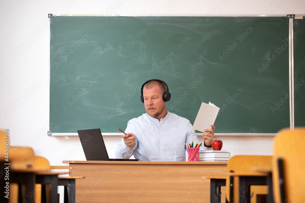 Young teacher conducts online webinars, online classes, online presentation. Education concept. Young teacher conducts online webinars, online classes, online presentation. Education concept.