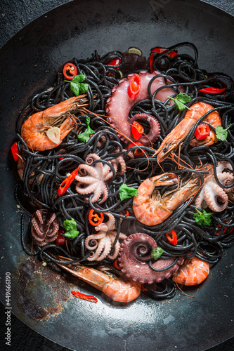 Spicy seafood black pasta with shrimp. Fresh pasta with seafood.
