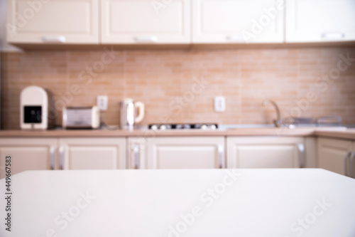 Cozy bright kitchen interior with wooden furniture