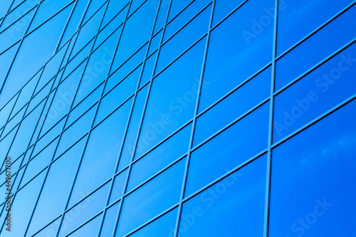 glazed facade. glazed facade against a blue background. modern skyscrapers of downtown.