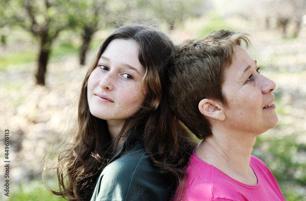 portrait of mom and teenage daughter outdoors portrait of mom and teenage daughter outdoors