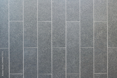 Dark gray granite tiles pattern texture background.