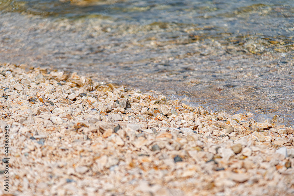Pebbles on the seashore. Seashore with a rocky beach. Pebbles on the seashore. Seashore with a rocky beach.