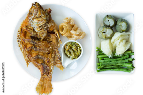 Konstfotografi Top view fried tilapia fish and Thai Green Chilli Dip with blanched vegetables, focus selective