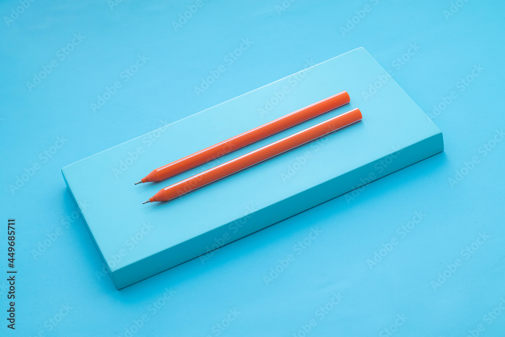 Orange Ballpoint on Blue background. Blue board Orange Ballpoint on Blue background. Blue board