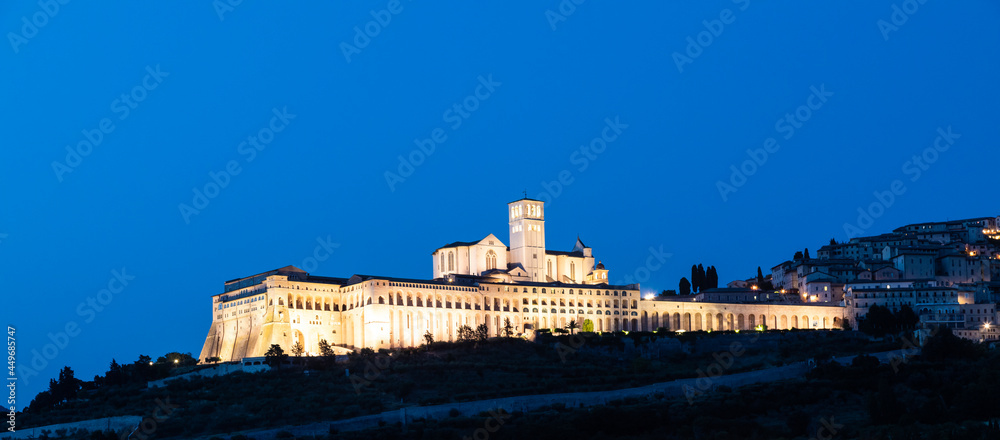 Assisi Basilica by night,  Umbria region, Italy. The town is famous for the most important Italian Basilica dedicated to St. Francis - San Francesco.