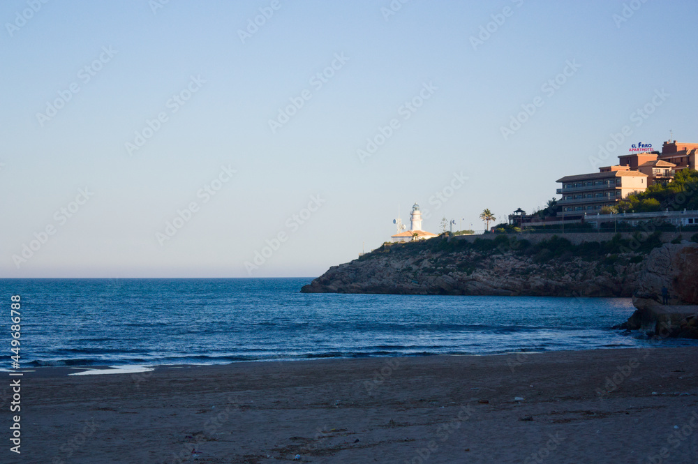 Lighthouse of the Dosel beach in the coastal town of Cullera (Valencia)