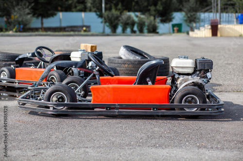 A go-karting car is standing on the highway and waiting for the driver. Go-karting cars for children and adults.