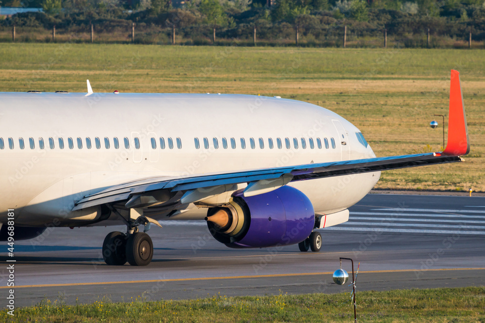 Close-up view taxiing of a passenger airliner on the runway Close-up view taxiing of a passenger airliner on the runway