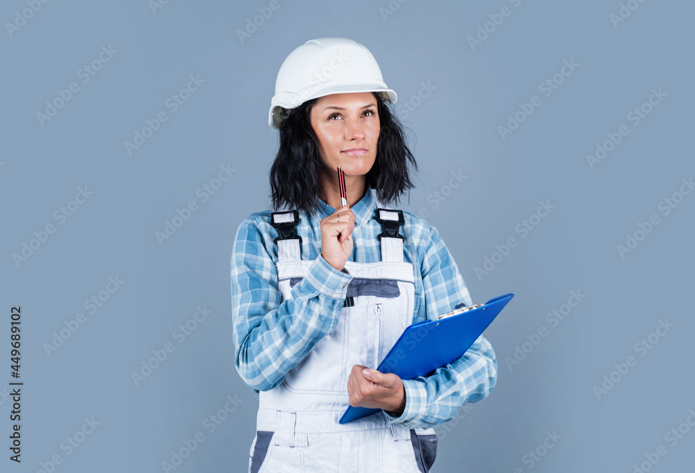 Your one stop source. mechanic girl in protective hardhat. building and construction. professional manual worker. technician working folder planning documents. safety uniform Your one stop source. mechanic girl in protective hardhat. building and construction. professional manual worker. technician working folder planning documents. safety uniform