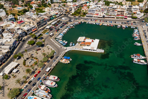 ELOUNDA, CRETE/GREECE - JULY 16 2021: Aerial view of the port and resort town of Elounda on the Greek island of Crete photo