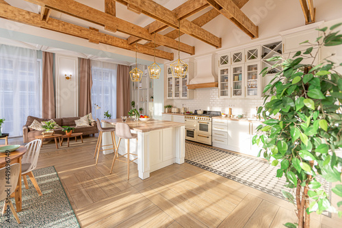 modern expensive luxurious open-plan apartment. Rich Scandinavian-style interior with wooden beams on the ceiling in pastel colors