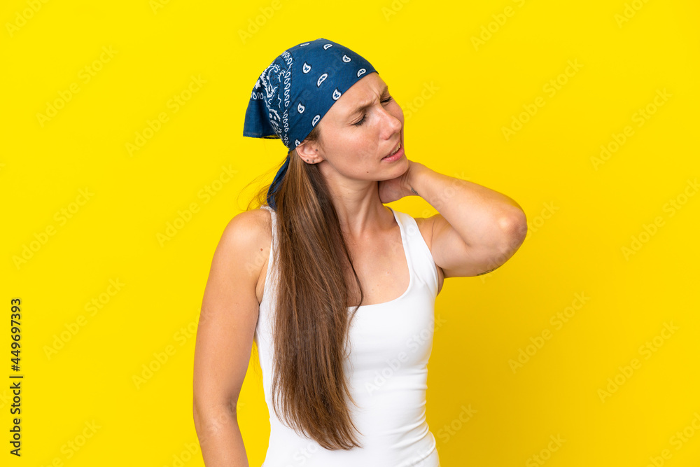 Young English woman isolated on yellow background with neckache Young English woman isolated on yellow background with neckache