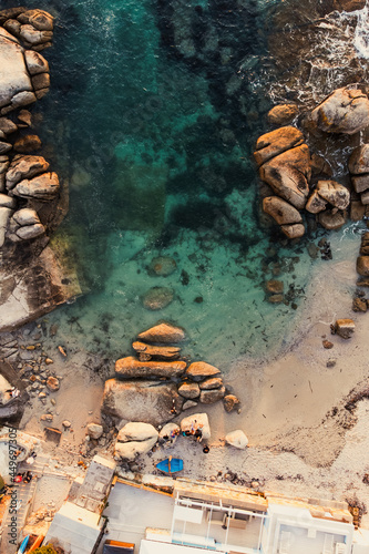 Boulders and sandy beach in Cape Town, South Africa, Bakoven beach